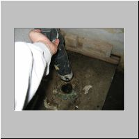 09. and now it's not attached, flooding sewage into the middle room.jpg